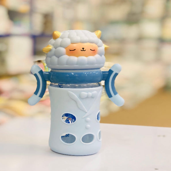 Children's cup with cartoon sheep design on a blurred background